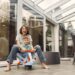 A happy mother and child enjoying natural light in a sunroom with energy-efficient glass windows.